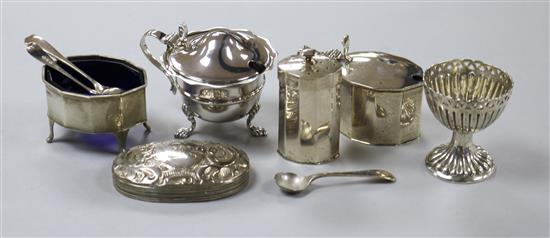 Four assorted silver condiments, three silver condiment spoons, a silver lid and a plated egg cup.